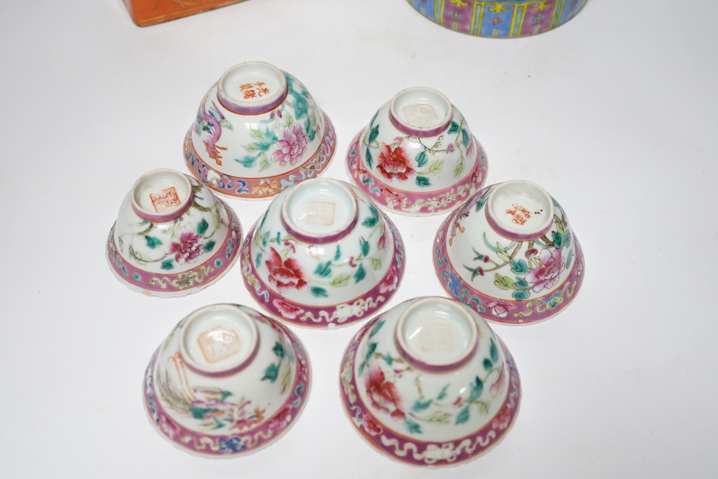 A Chinese Straits enamelled porcelain teapot and cover and seven similar tea bowls, Guangxu period and a pillow, teapot 18cm high including cover